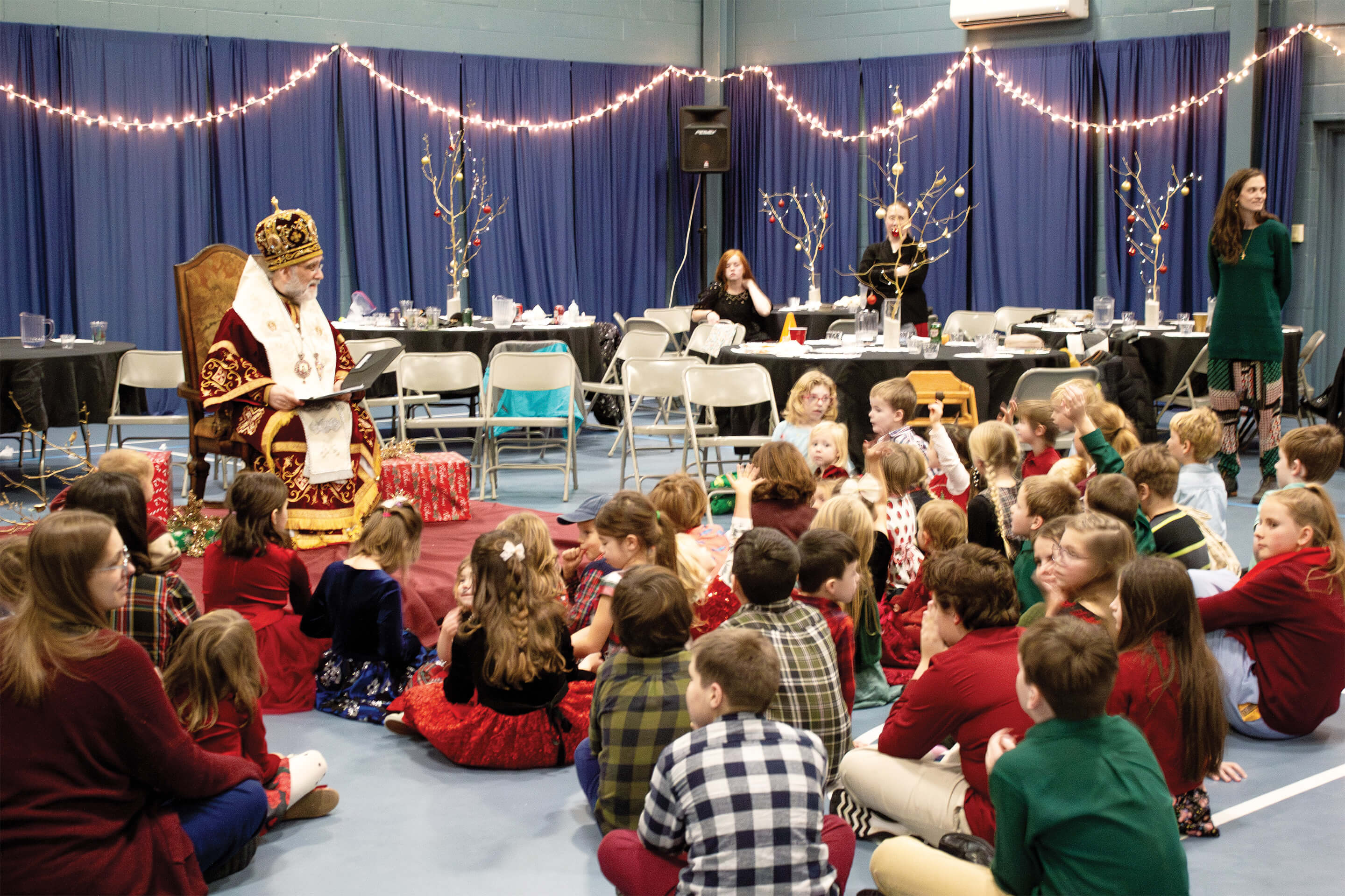 St. Tikhon's Seminary Community children gathered in front of the rector on St. Nicholas Day.