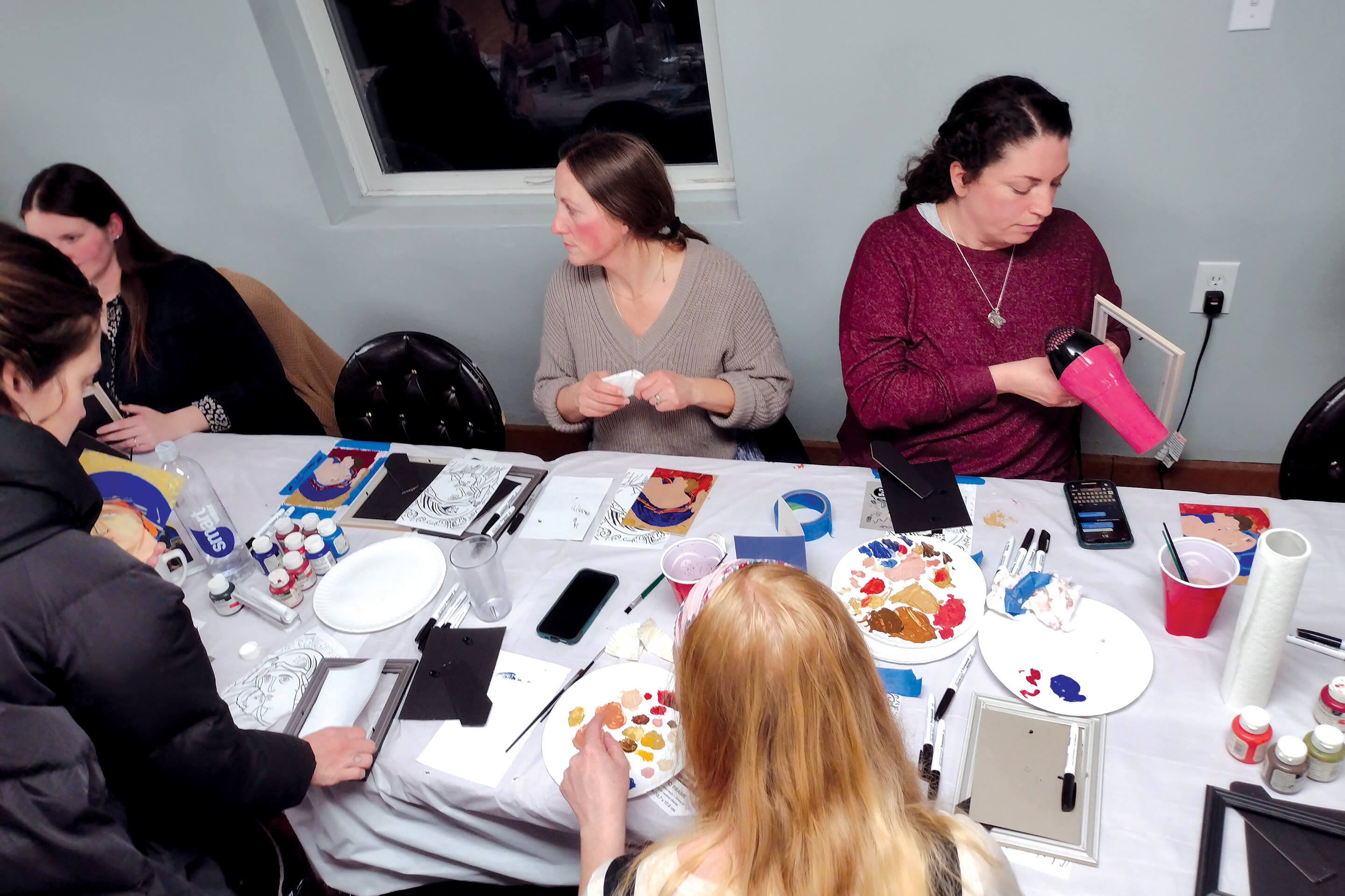 St. Tikhon's Seminary Community seminary wives painting at a crafting event.