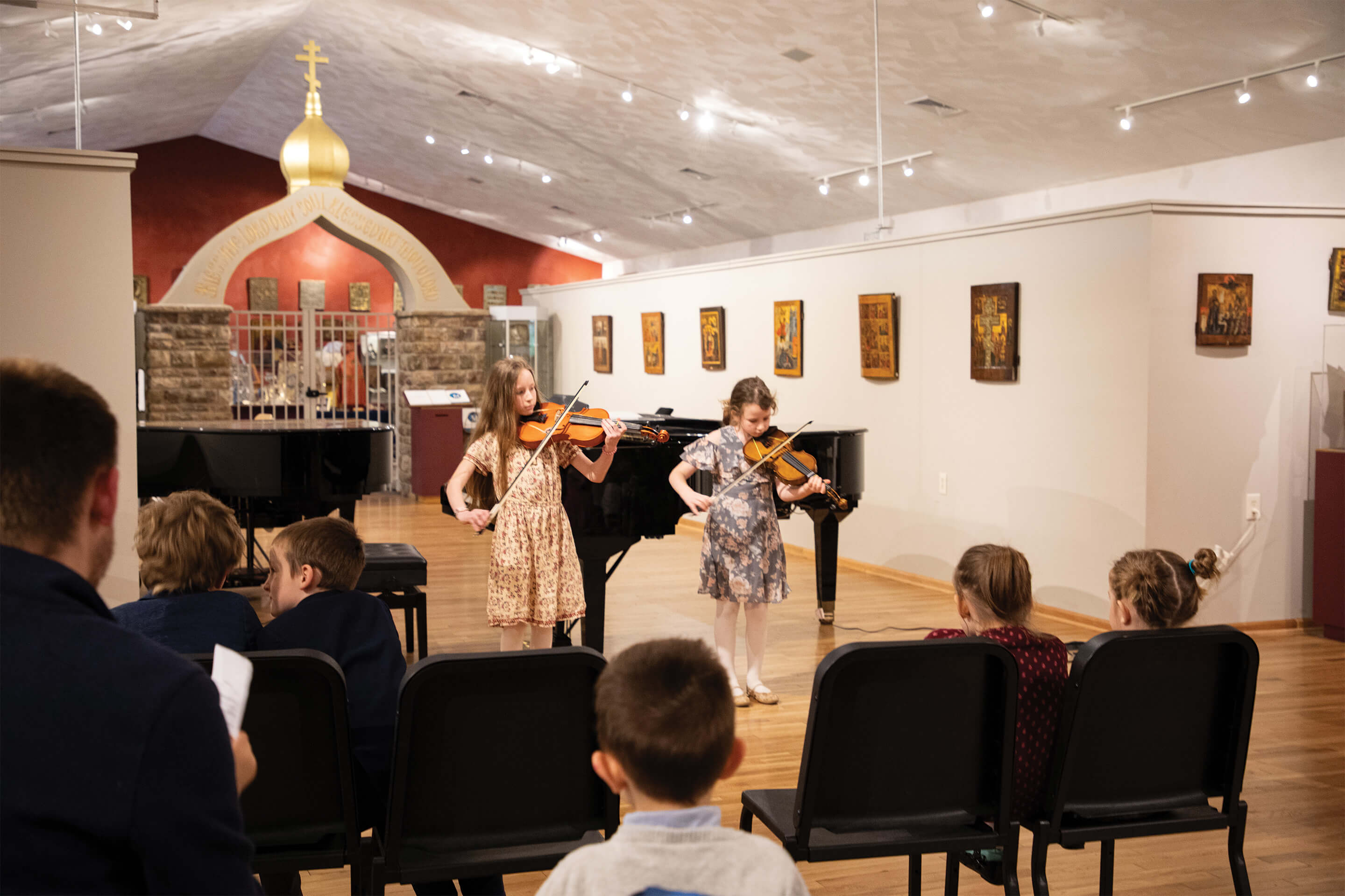 St. Tikhon's Seminary Community seminary children performing on violins at children's recital night. 