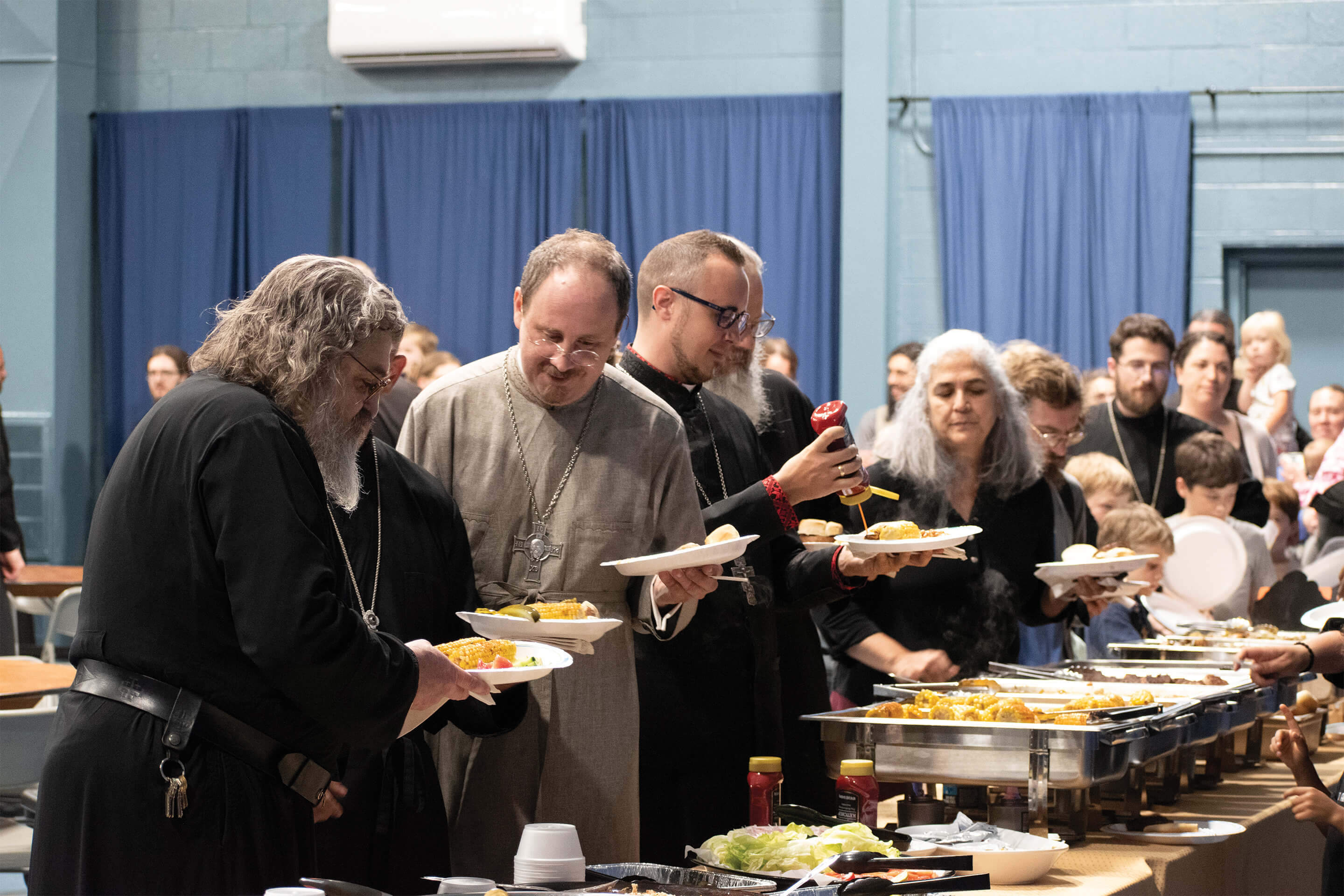St. Tikhon's Seminary Community community members in fellowship over dinner.