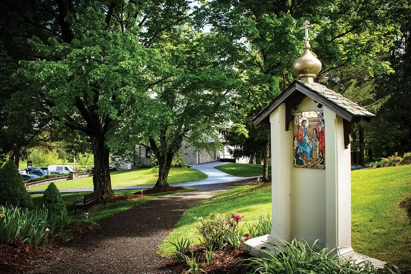 St. Tikhon's Seminary Give SmartGiving Tools shrine alongside a path in a garden.