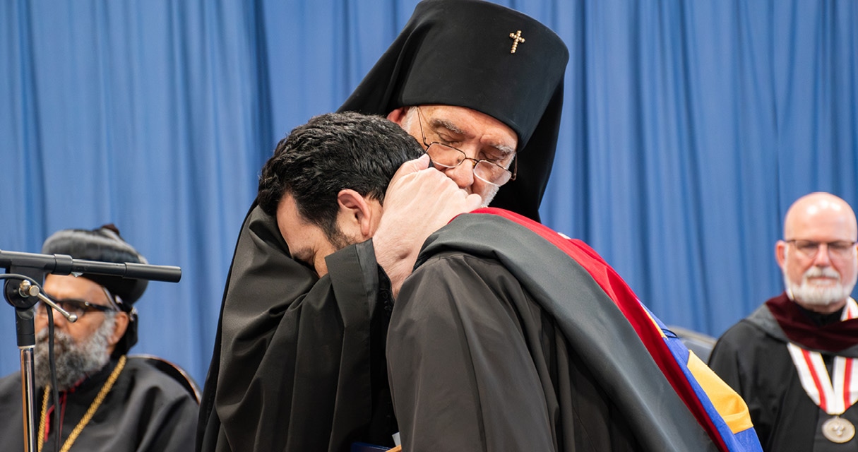 St. Tikhon's Seminary News & Events Eighty-fourth Annual Commencement Exercises Archbishop Michael hugging a graduate.