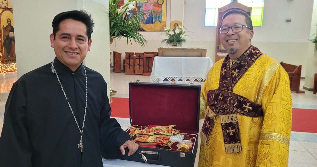 St. Tikhon's Seminary News & Events Subdn. Michael Pak and priest stand with donated clerical items.