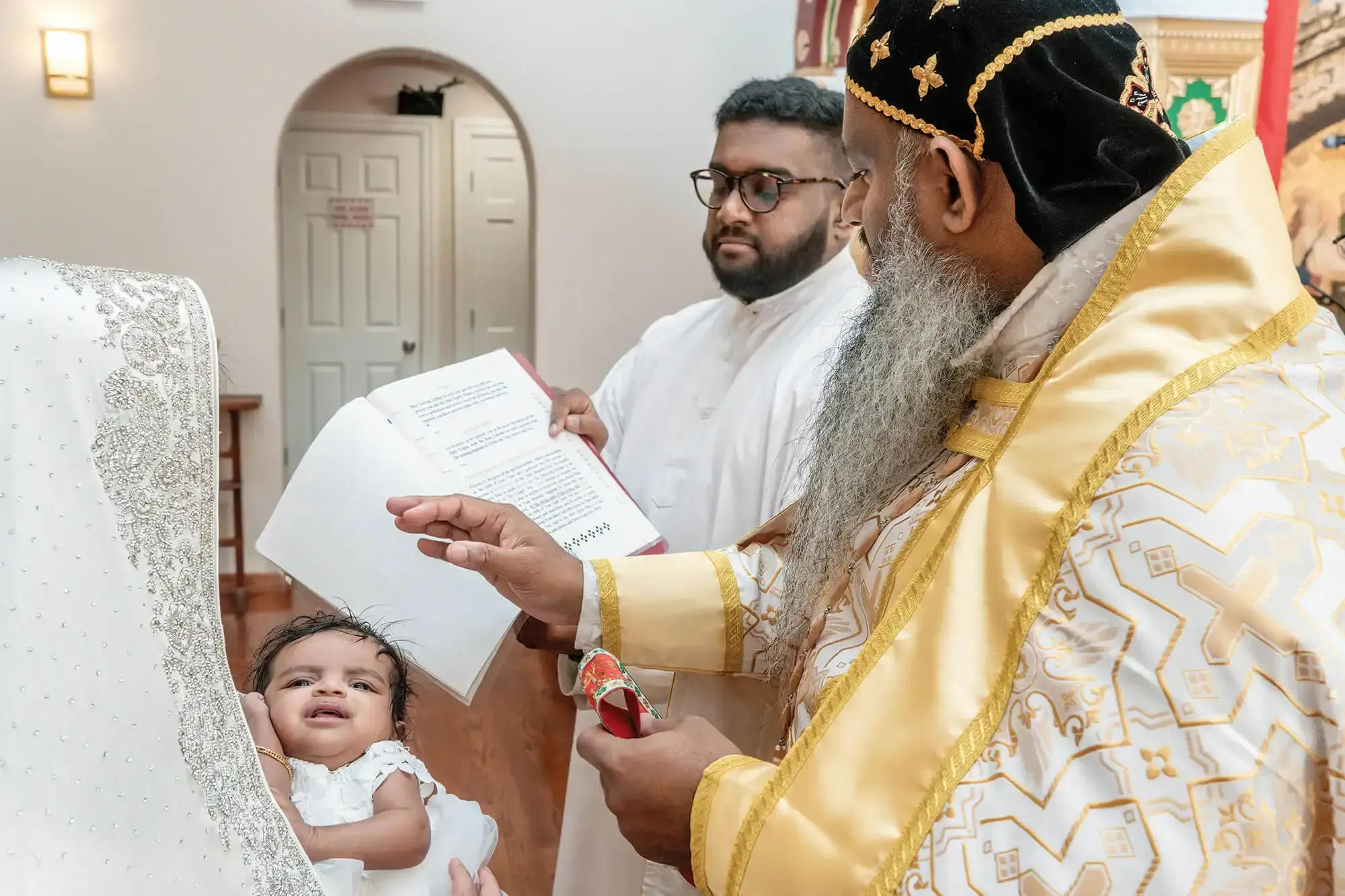 St. Tikhon's Seminary Stories Joel Kuriakose Kurian assisting with a Malankara baptism.